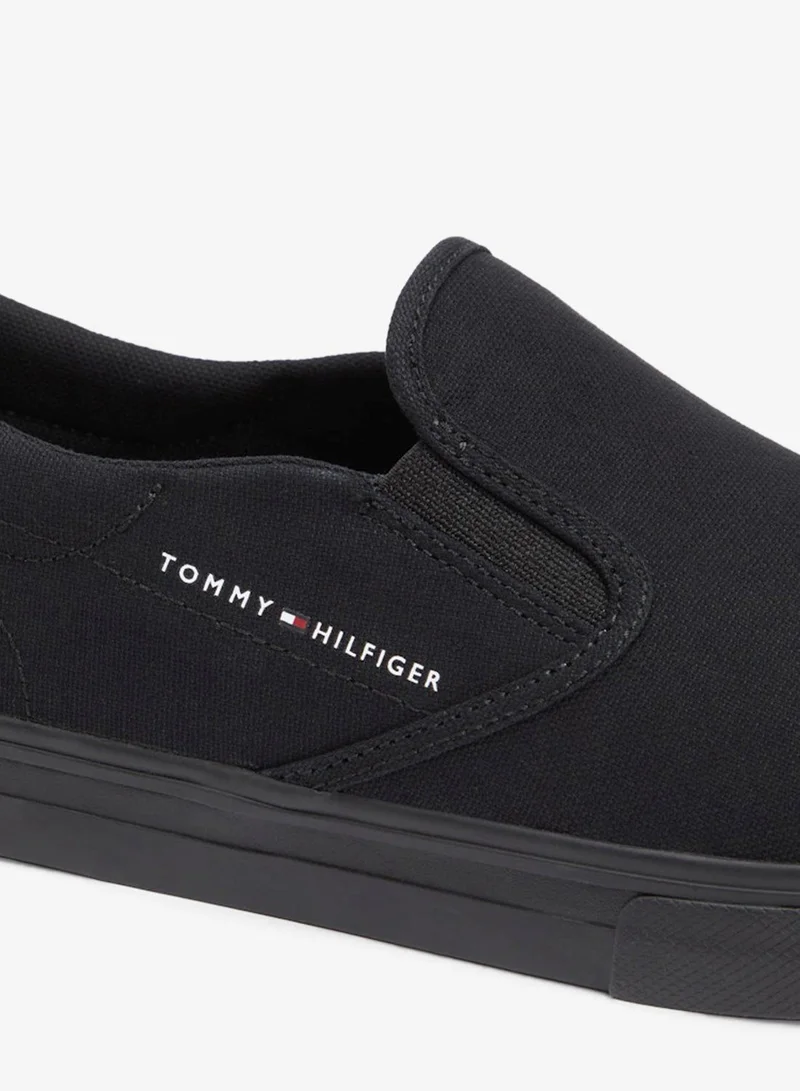 Tommy Hilfiger – Tommy Hilfiger Black Canvas Slip-On Shoes for Men | Best Price UAE